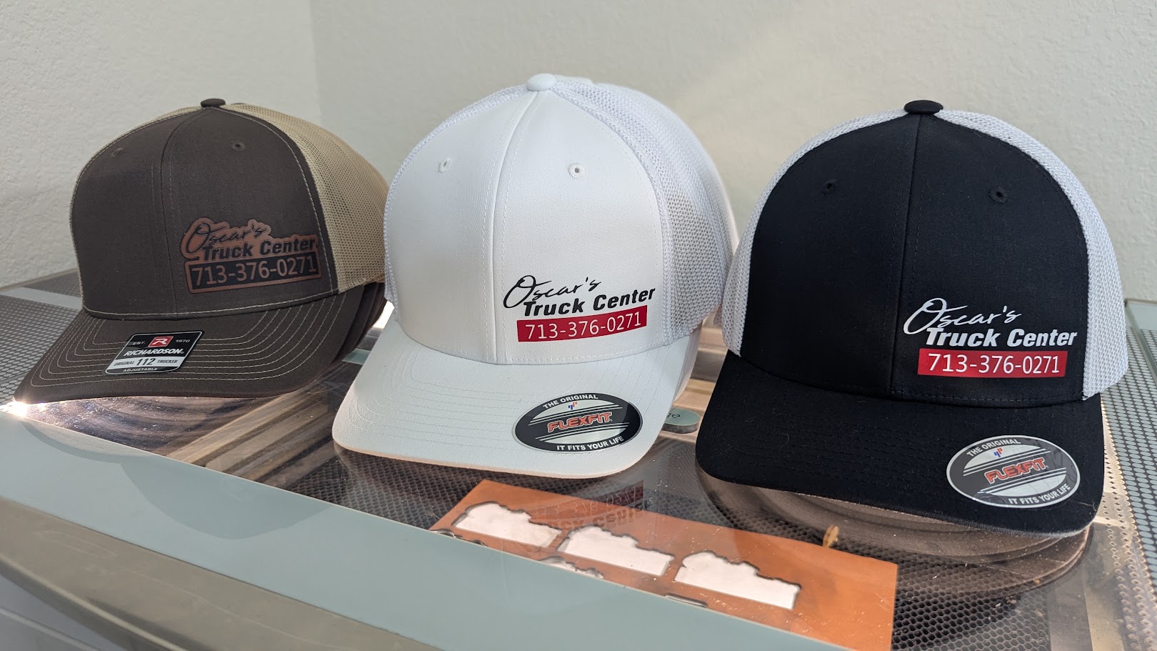 Three custom hats created for Oscar's Truck Center