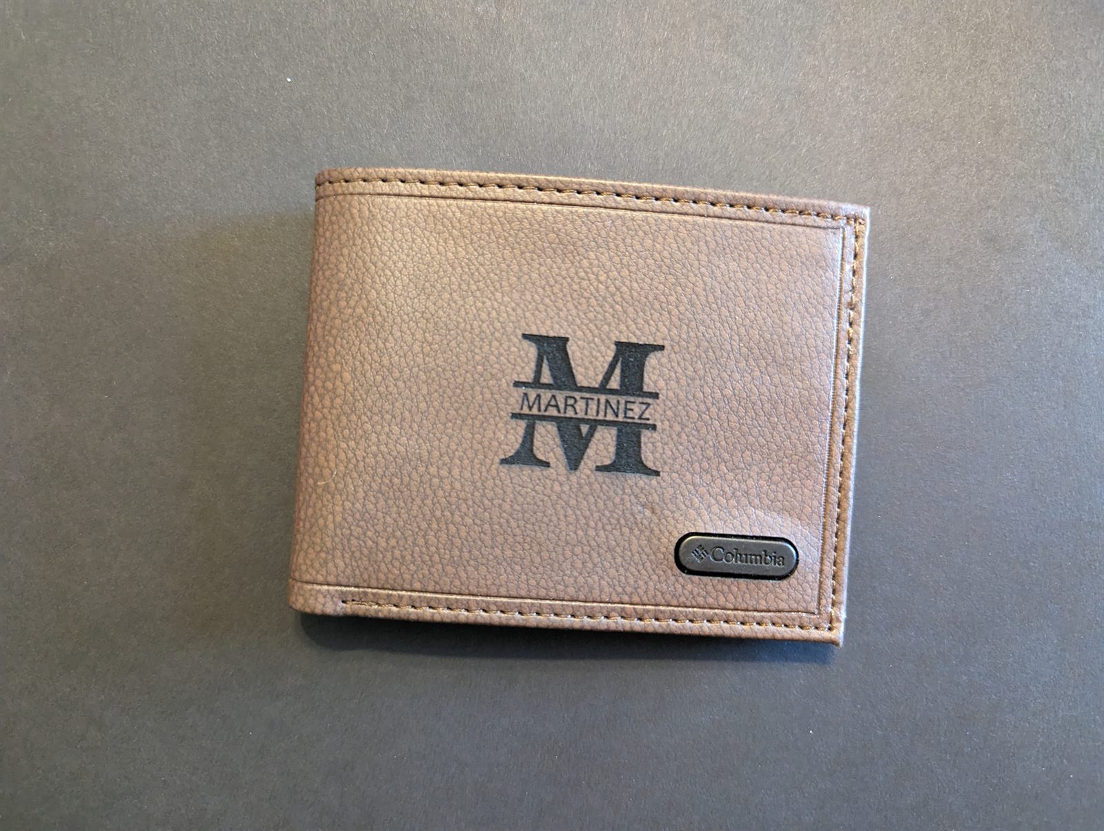 Laser engraved monogram on a leather wallet