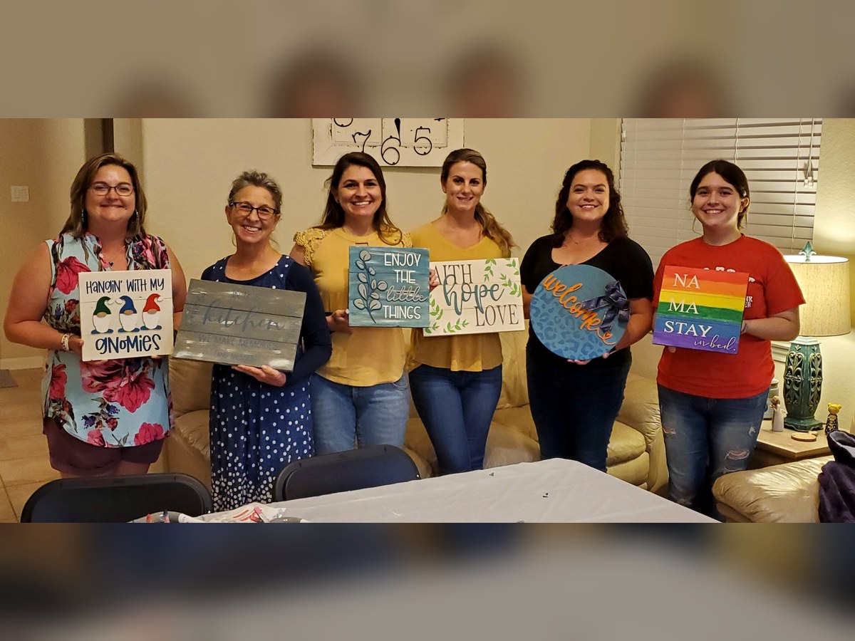 Paint party group holding completed SIS projects