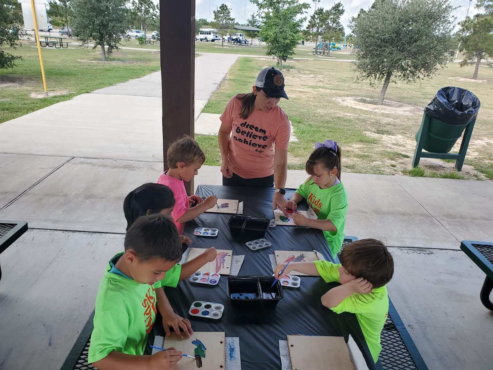 Children painting at a SIS paint party