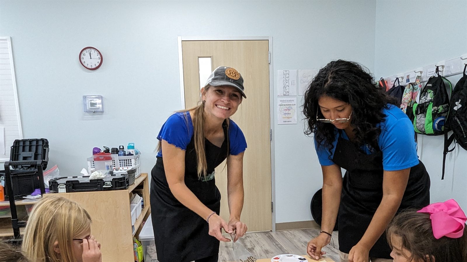 SIS leading a hands-on group project with kids